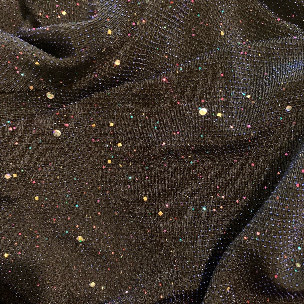 Beautiful new, stretchy, classy , small to size. Fits body nicely , Not worn.